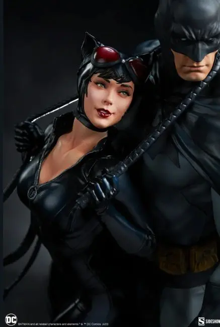 Batman and Catwoman in black costumes