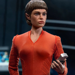 Woman in red costume holding gadget
