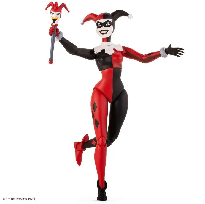 Playful clown doll with mask and scepter