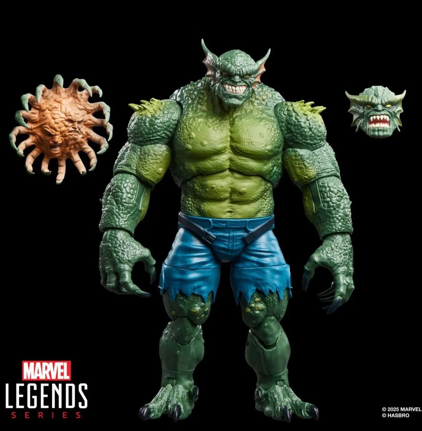 Detailed green figure with alternate heads