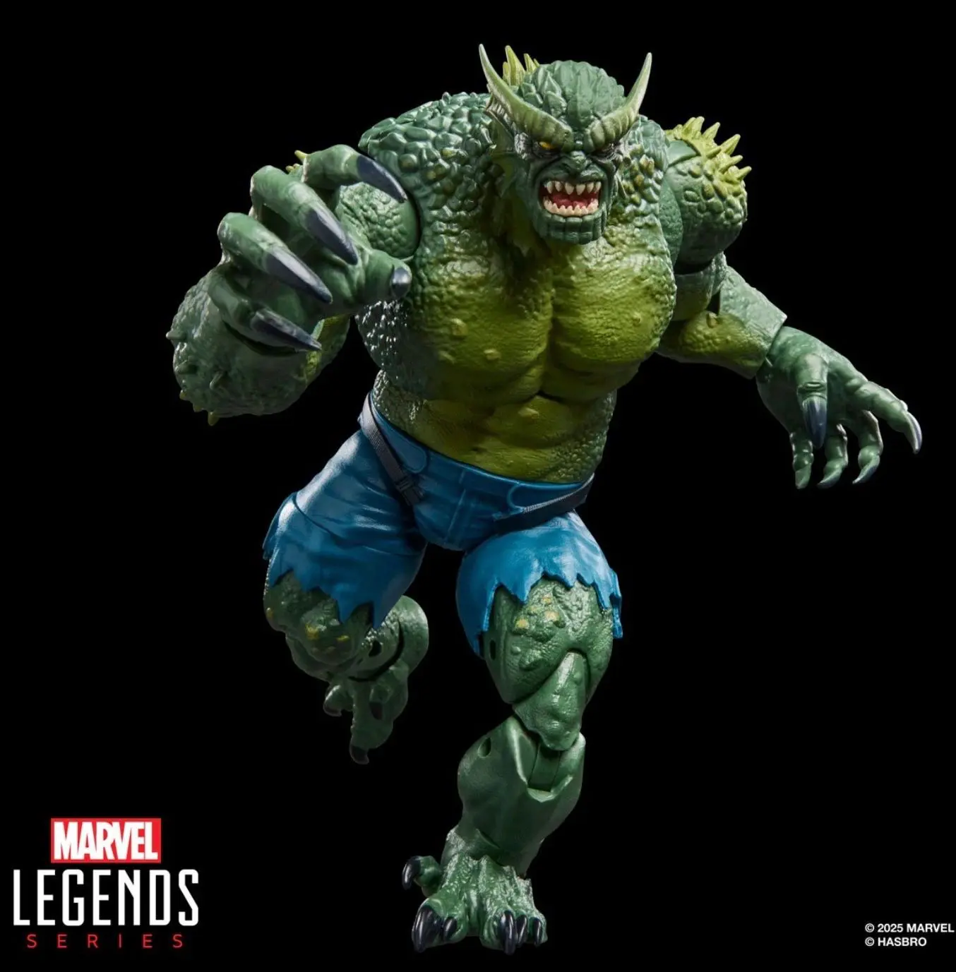 Green creature action figure with claws
