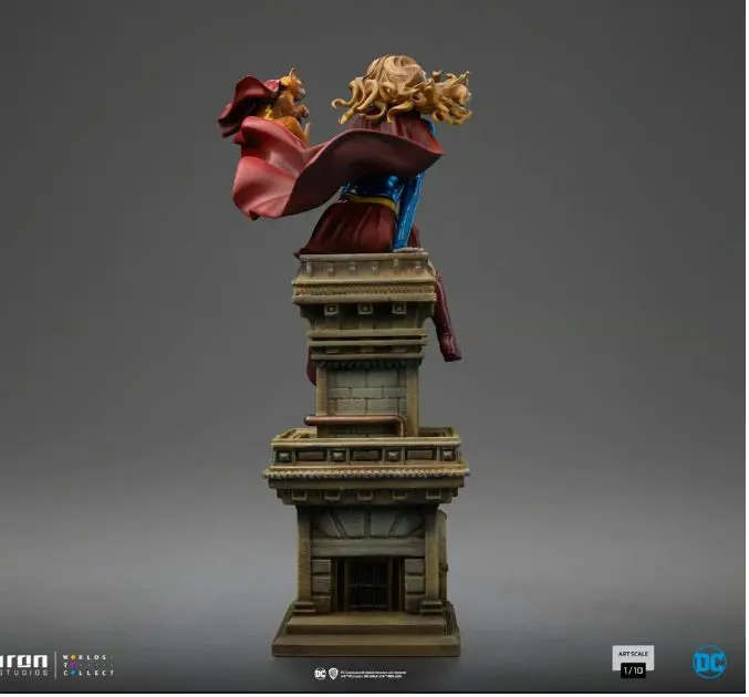 Superhero figurine on a building pedestal