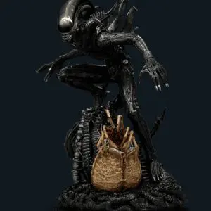 Alien creature figure emerging from an egg.