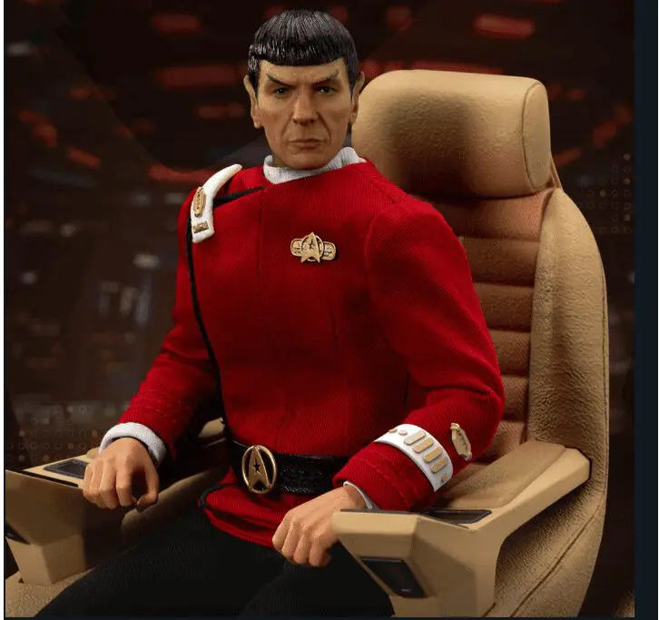 Spock action figure seated in command chair.