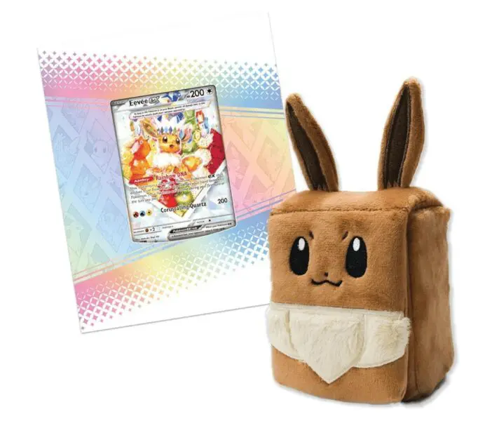 Eevee plush toy next to trading card.
